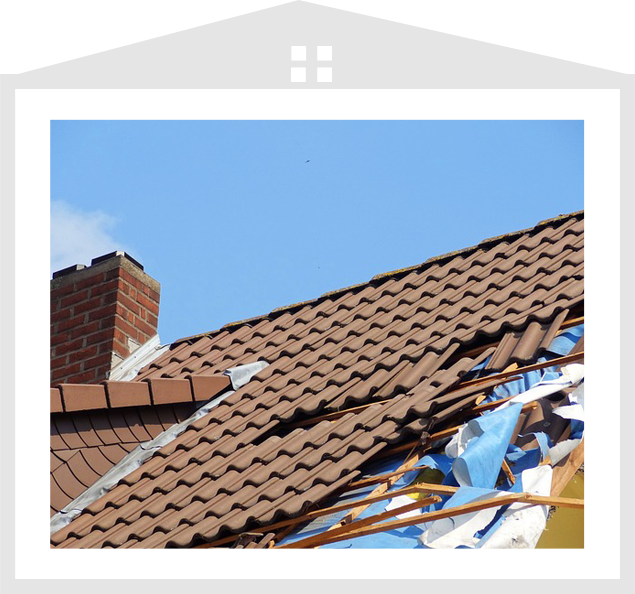 A picture of the roof of a house with some damage.